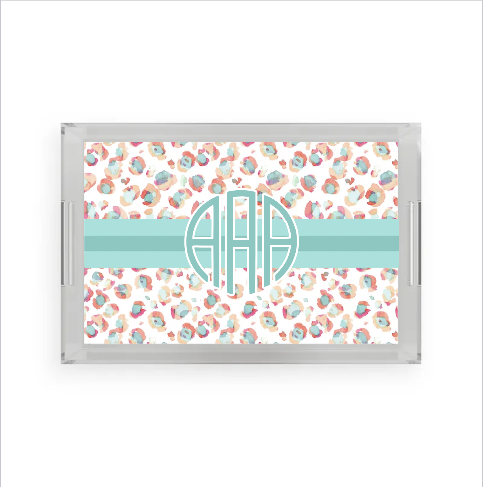 Acrylic tray with a colorful watercolor cheetah print background and monogram in aqua as personalized present