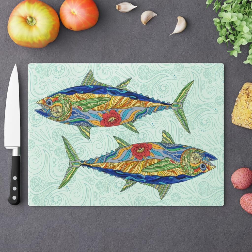 Blackfin tuna glass charcuterie board showing two mirrored fish on a glass coastal decor cutting board