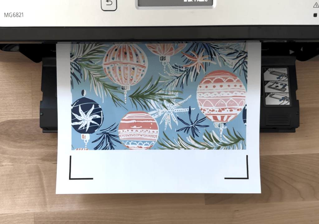 Saltsy whimsical ornaments artwork shown coming out of printer