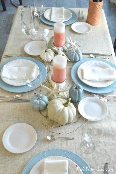 Coastal tablescape with blue and white pumpkins and bleached starfish